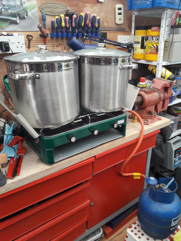 Picture of boiling the wort on a camping stove in the garage